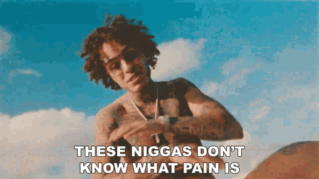 a picture of a man with the words " these niggas don 't know what pain is " on it