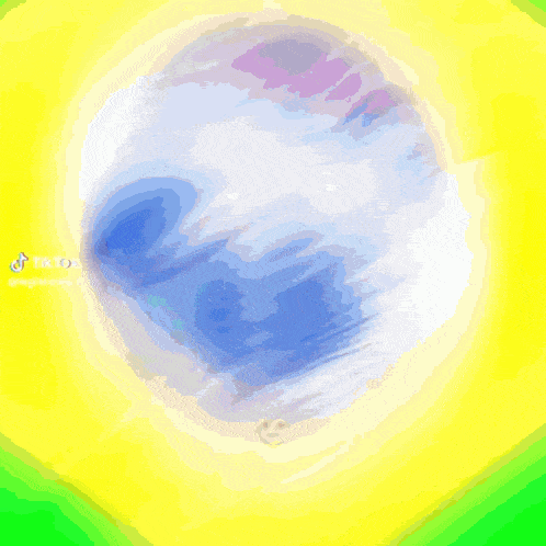 a blurry picture of a soccer ball on a yellow and green background that says tiktok