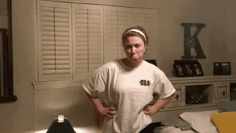 a woman in a white t-shirt with sga on it
