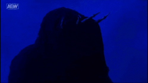 a silhouette of a person with horns and the aew logo