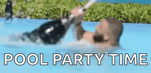 a man is laying in a pool with a bottle of champagne in his hand .