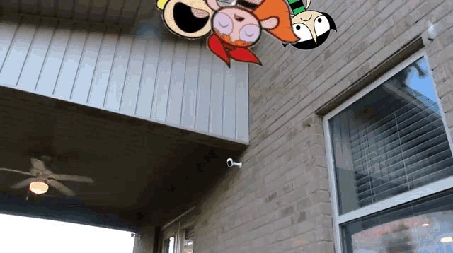 the powerpuff girls are flying through the air on a brick building