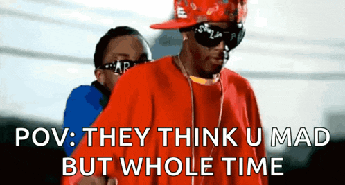 a man wearing sunglasses and a red shirt says pov they think u mad but whole time .