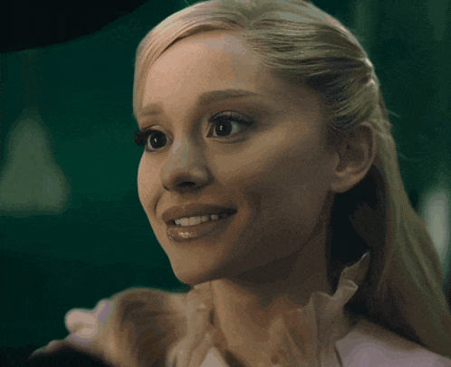 a close up of a woman 's face smiling