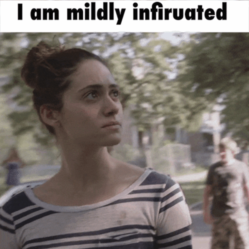 a woman in a striped shirt with the words " i am mildly infatuated " below her