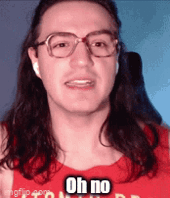 a man with long hair is wearing glasses and a red shirt that says oh no