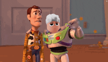 woody and buzz lightyear are standing next to each other in a room