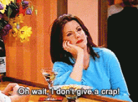 a woman is sitting at a bar with a martini glass and says oh wait i don 't give a crap