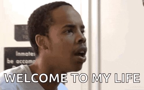 a man is making a funny face and saying welcome to my life