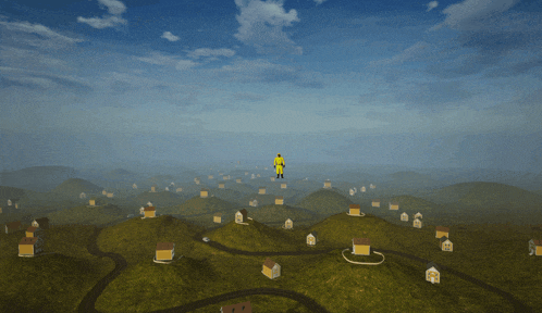 a man in a yellow suit is flying over a landscape with houses