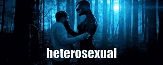 a man and a woman are hugging each other in a forest .