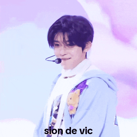 a close up of a person 's face with the words sion de vic written on the bottom