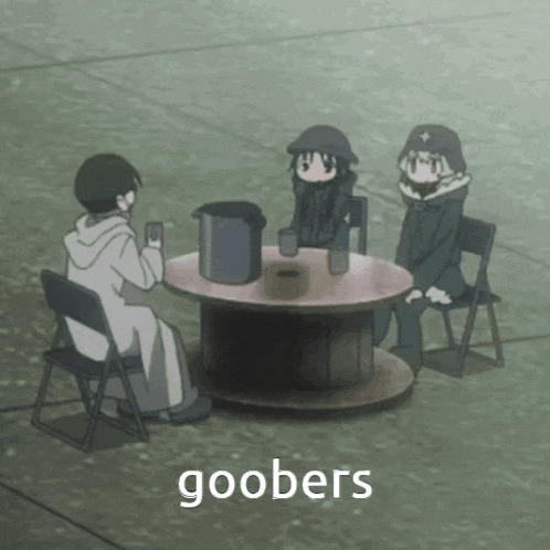 a group of people sitting around a table with the word goobers on the bottom right