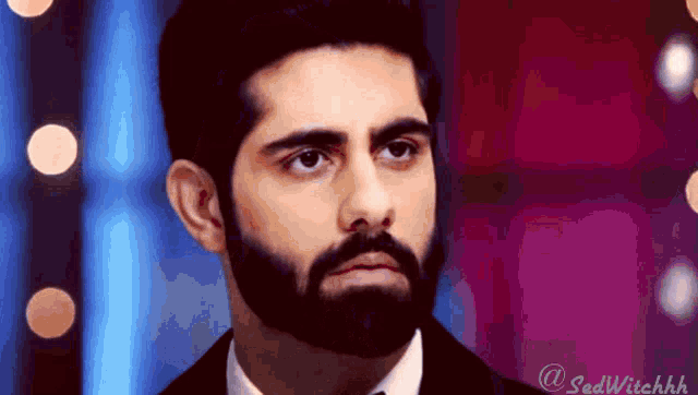 a man with a beard is wearing a suit and tie with the hashtag sadwitchhh