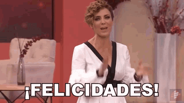 a woman in a white dress says felicidades in black letters