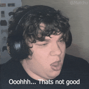 a man with curly hair wearing headphones says ooohh thats not good