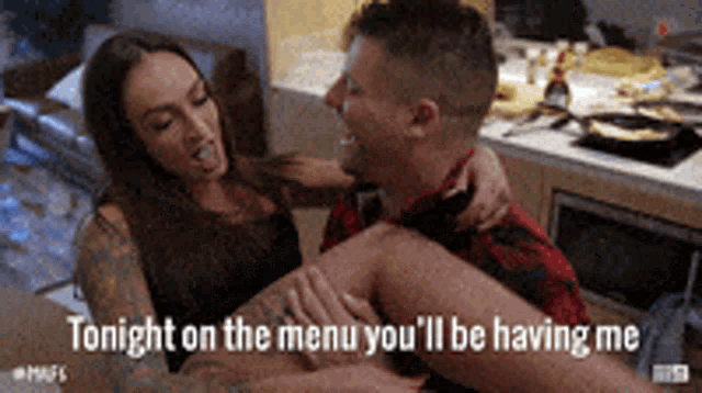 a man is holding a woman 's leg and the words tonight on the menu you 'll be having me