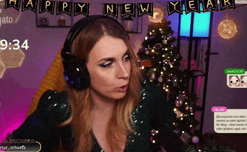 a woman wearing headphones is sitting in front of a christmas tree and a banner that says happy new year