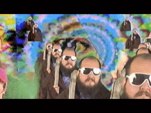 a group of bearded men wearing sunglasses are walking through a tunnel