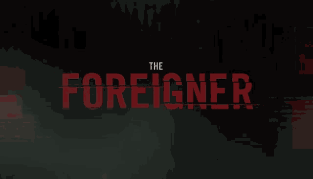 a dark background with the words the foreigner in red