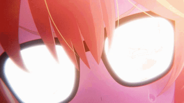 a close up of a person 's eyes with red hair and glasses
