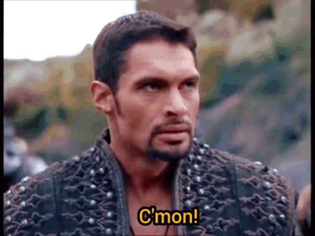 a man with a beard is saying c'mon in a video