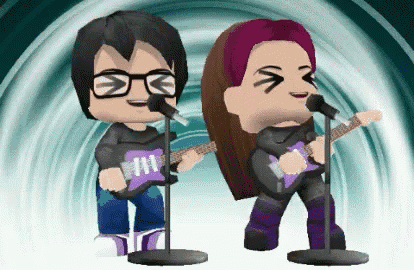 a man and a woman singing into microphones while playing guitars