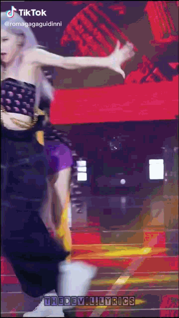 a tiktok video of a woman dancing with the devil lyrics