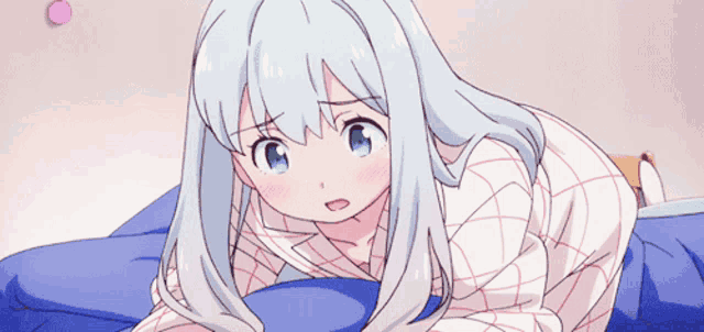 a girl with long white hair is laying on a bed