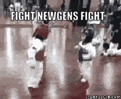 a basketball game is being played with the words `` fight new gens fight '' written on the bottom of the screen .