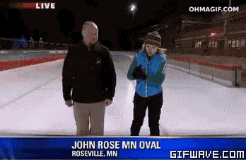 a man and a woman are standing in front of a sign that says john rose mn oval on it