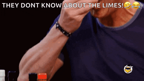 a man is drinking from a bottle with the words they dont know about the limes above him