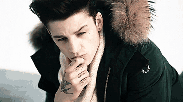a man with a tattoo on his wrist that says ' i 'm sorry '
