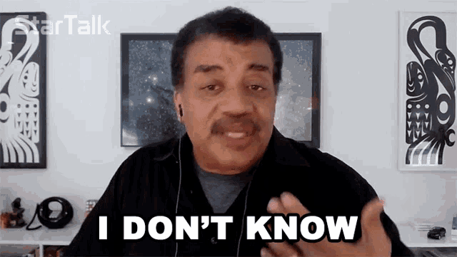 a man says i don 't know while wearing ear buds
