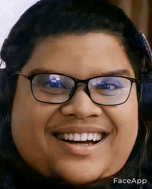 a close up of a person 's face with glasses and the word faceapp on the bottom