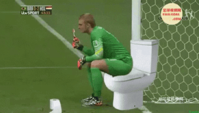a soccer player sits on a toilet during a match