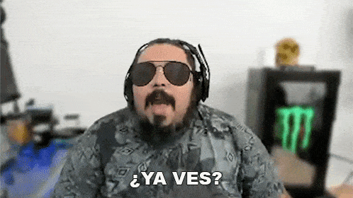a man with a beard and sunglasses is wearing headphones and saying ya ves ?