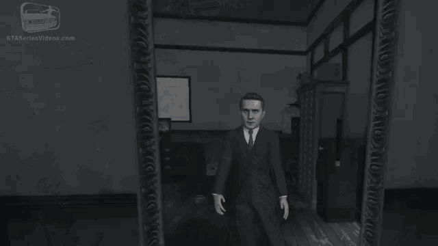 a man in a suit and tie is standing in a room with a hand reaching out