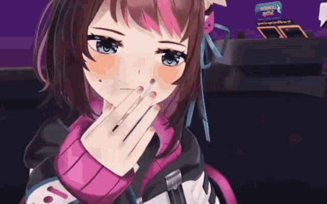 a girl in a pink sweater holds her hand to her mouth