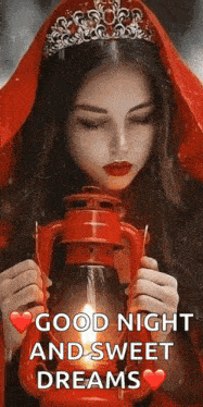 a woman wearing a tiara is holding a red lantern .