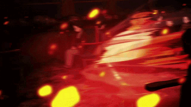 a blurry picture of a person in a red dress