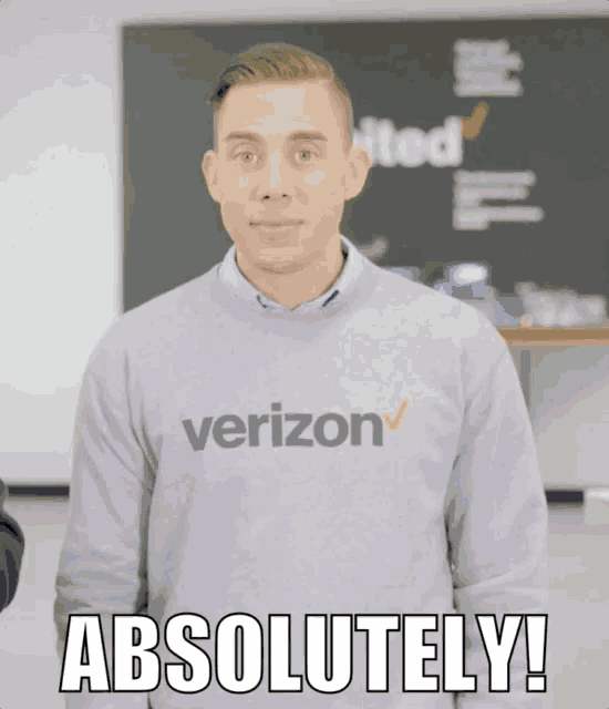 a man wearing a sweater that says verizon says absolutely