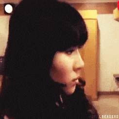 a close up of a woman 's face with a headset on .