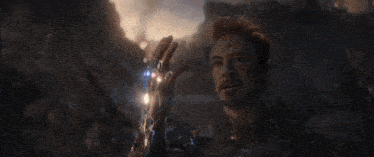 a close up of a man giving a thumbs up in a movie scene .