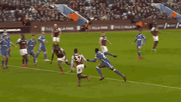 a soccer game is being played in front of a banner that says avfcofficial