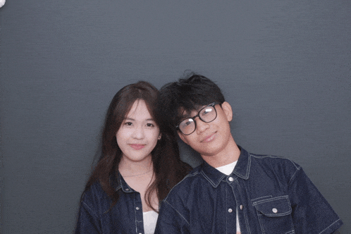 a man and a woman pose for a picture together