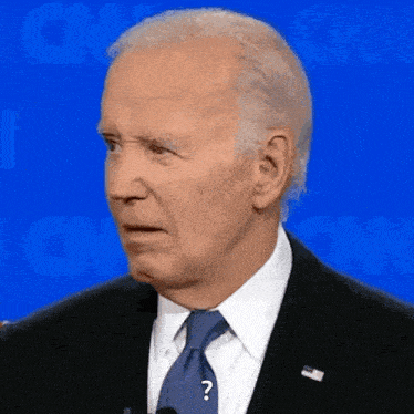 a man in a suit and tie with a question mark on his neck