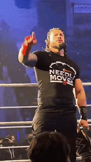 a wrestler wearing a shirt that says needle move