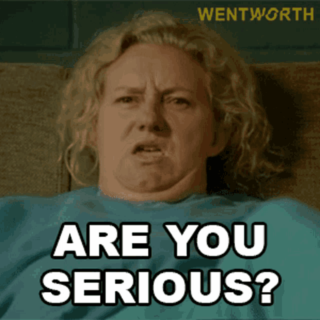 a woman is sitting on a couch with the words " are you serious " on her face