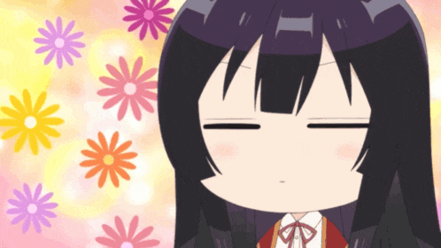 a close up of a girl 's face with flowers behind her